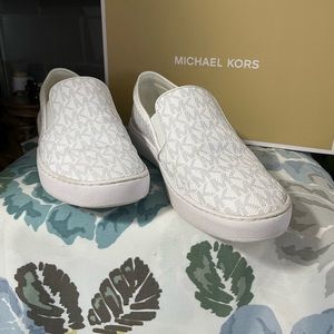 Michael Kors white slip on sneaker with MK logo. Size 6.